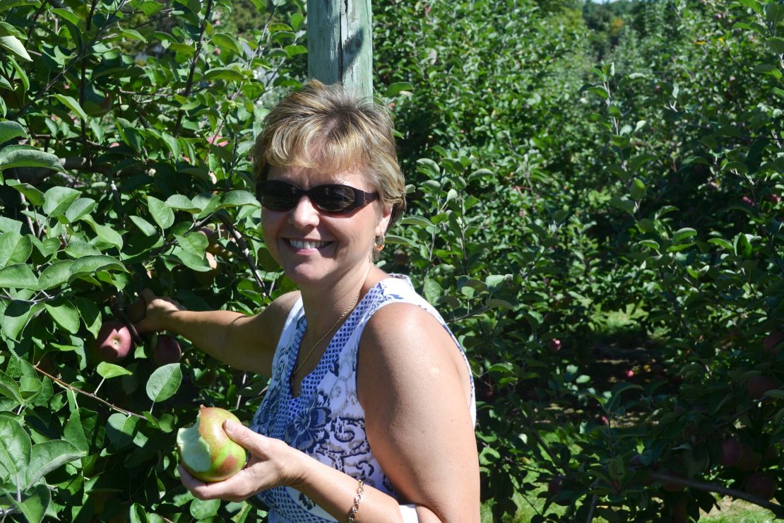 Peg Stansfield picking apples