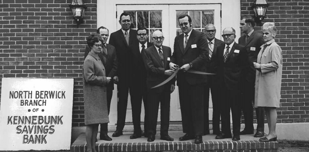 Staff cutting the ribbon at the opening of the North Berwick branch.